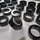 BK Racing Solid Rear Lower Control Arm Bushings (Pair) – Zero-Deflection Upgrade with In-House Machined Sleeves