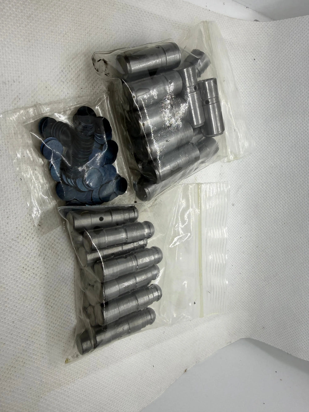 Packaged Ecotec solid lash adjuster components